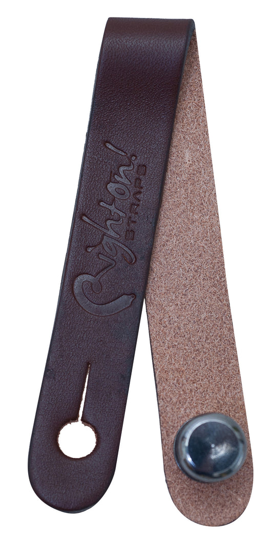 Attache-courroie, cuir, pour guitare ou basse acoustique, se place sous les cordes juste avant le sillet de tête, brun